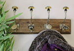 Load image into Gallery viewer, 4 Double Ceramic Gold &amp; Black Coat Hooks On Wooden Base
